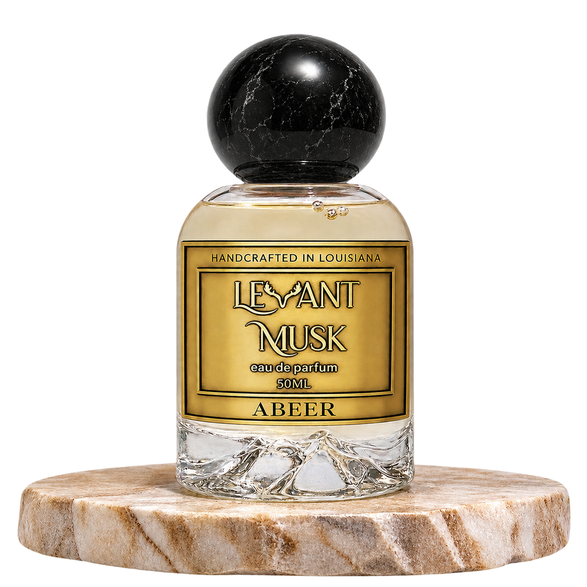A bottle of Levant Musk Eau de Parfum labeled Abeer, featuring a clear glass bottle with a black marble sphere cap, set on a round marble pedestal against a white background.