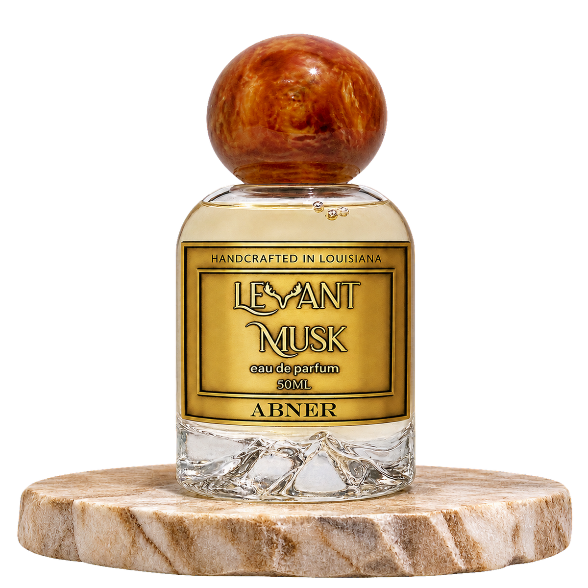 A bottle of Abner by  Levant Musk a Eau de Parfum with a round amber cap, displayed on a round marble coaster against a white background.