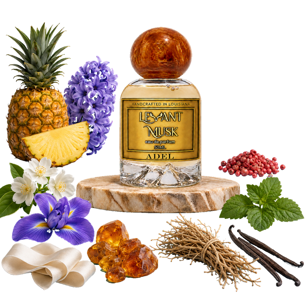A perfume bottle labeled Adel, by Levant Musk styled with its scent ingredients including a pineapple, purple flowers, white flowers, amber, vanilla beans, mint leaves, and berries on a white background.