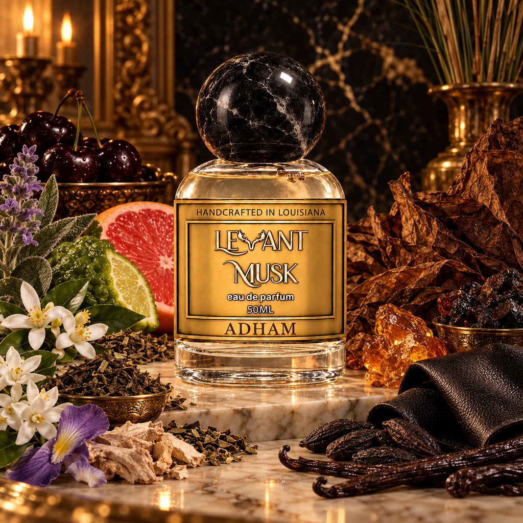 ADHAM by Levant Musk on marble, with black cherry, citrus, tobacco, tea, flowers, leather, vanilla and resin scent illustrations.