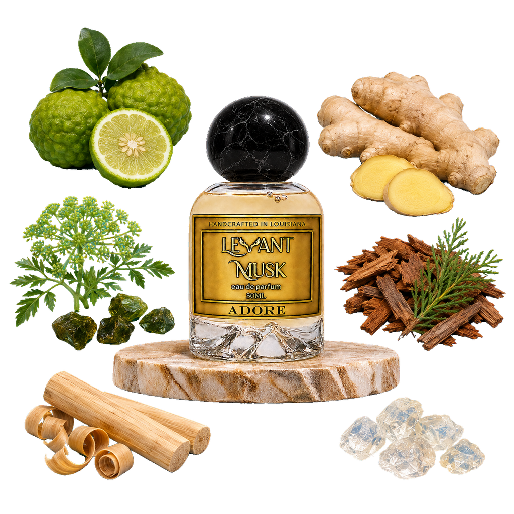 A bottle of  'ADORE' eau de parfum by Levant Musk centered on a marble-like round pedestal, surrounded by illustrated or photographed ingredients including green kumquats, ginger roots and slices, a green herb sprig, cinnamon sticks, and clear crystals on a white background.