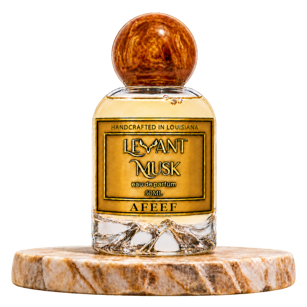 AFEEF by Levant Musk, 50 mL eau de parfum with an amber-brown spherical cap on a round marble pedestal.