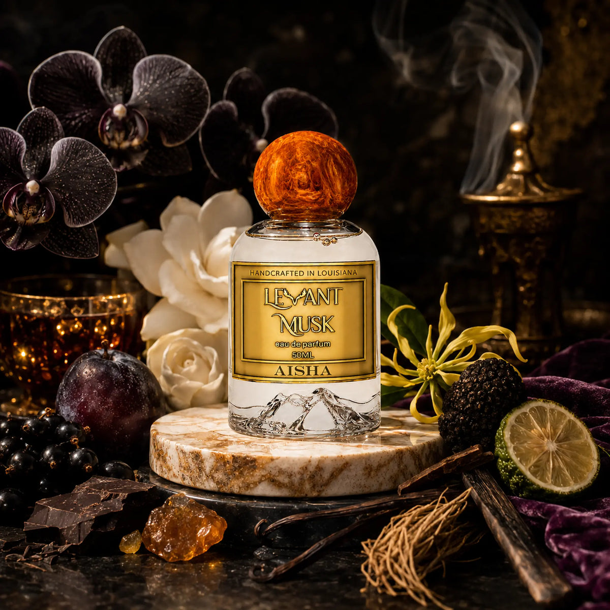 A bottle of Aisha by Levant Musk eau de parfum with a round amber cap, displayed on a marble coaster surrounded by dark purple orchids, a lime, dark plums, vanilla beans, and a smoking incense burner in a dark, moody setting.