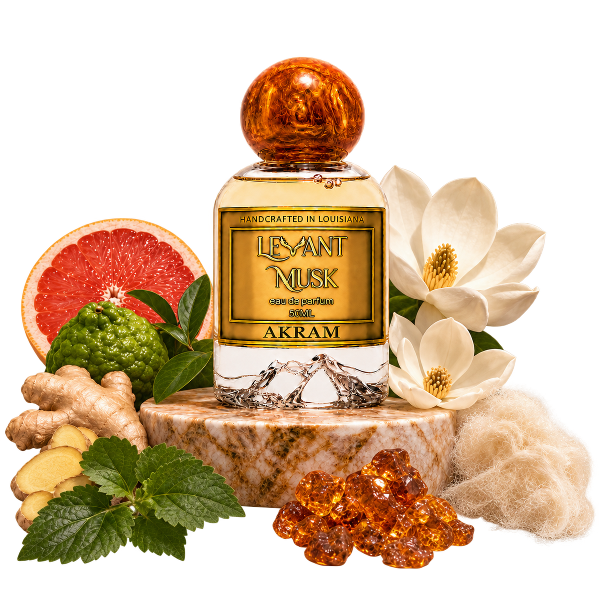 AKRAM by Levant Musk bottle on marble with grapefruit, bergamot, magnolia, ginger, patchouli leaves, musk and crystal amber. Transparent background.