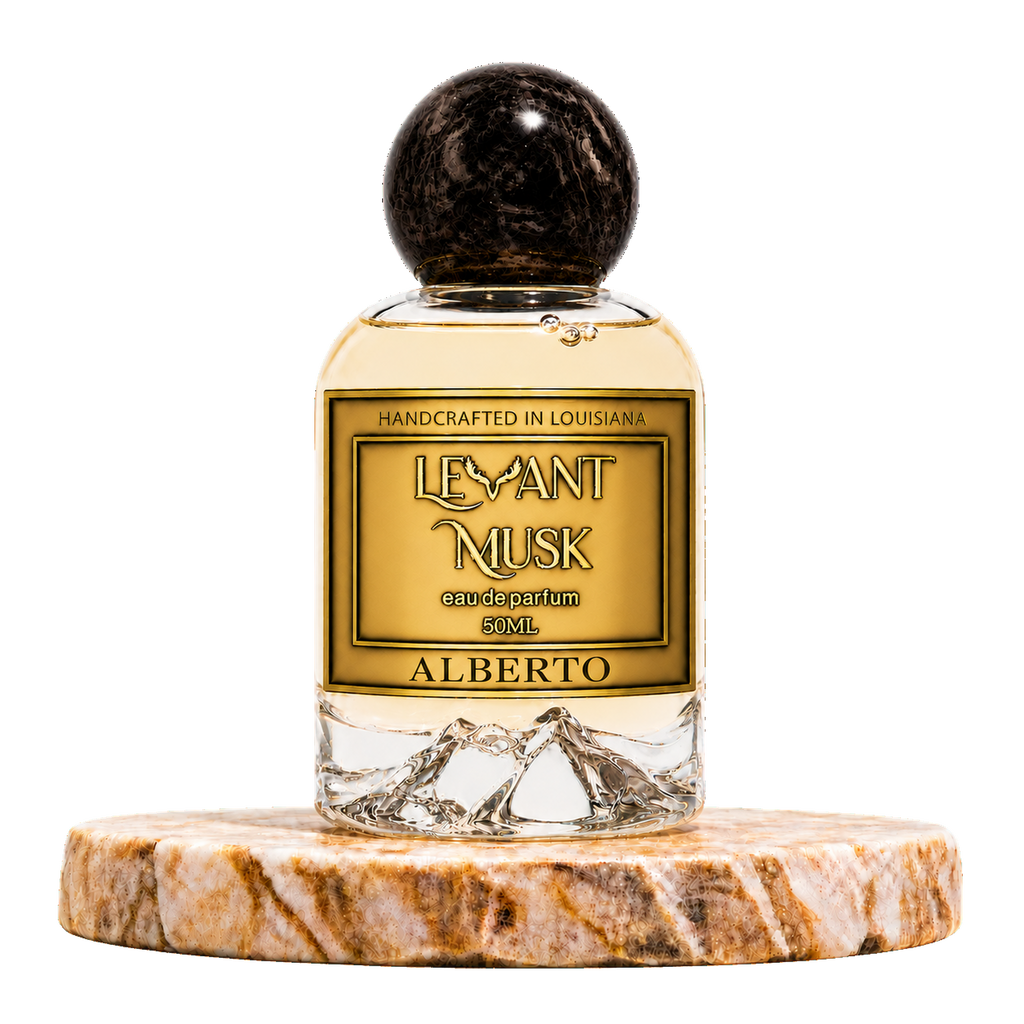 A 50ml bottle of Alberto by Levant Musk handcrafted eau de parfum, featuring a gold label and a dark wood-grain spherical cap, displayed on a round marble coaster against a white background.
