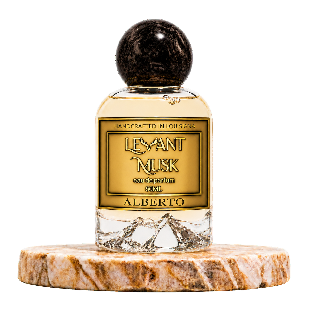 A 50ml bottle of Alberto by Levant Musk handcrafted eau de parfum, featuring a gold label and a dark wood-grain spherical cap, displayed on a round marble coaster against a white background.