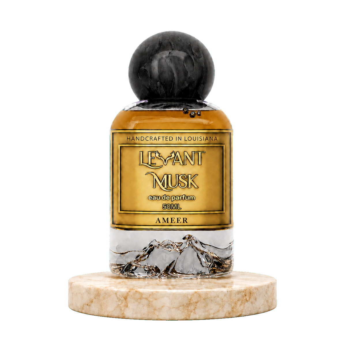 A 50mL bottle of Ameer by Levant Musk Eau de Parfum, featuring amber liquid, a gold label with black lettering, a black marble sphere cap, and a clear lower section showing gold mountain illustrations. The bottle is displayed on a round beige marble base against a solid white background.