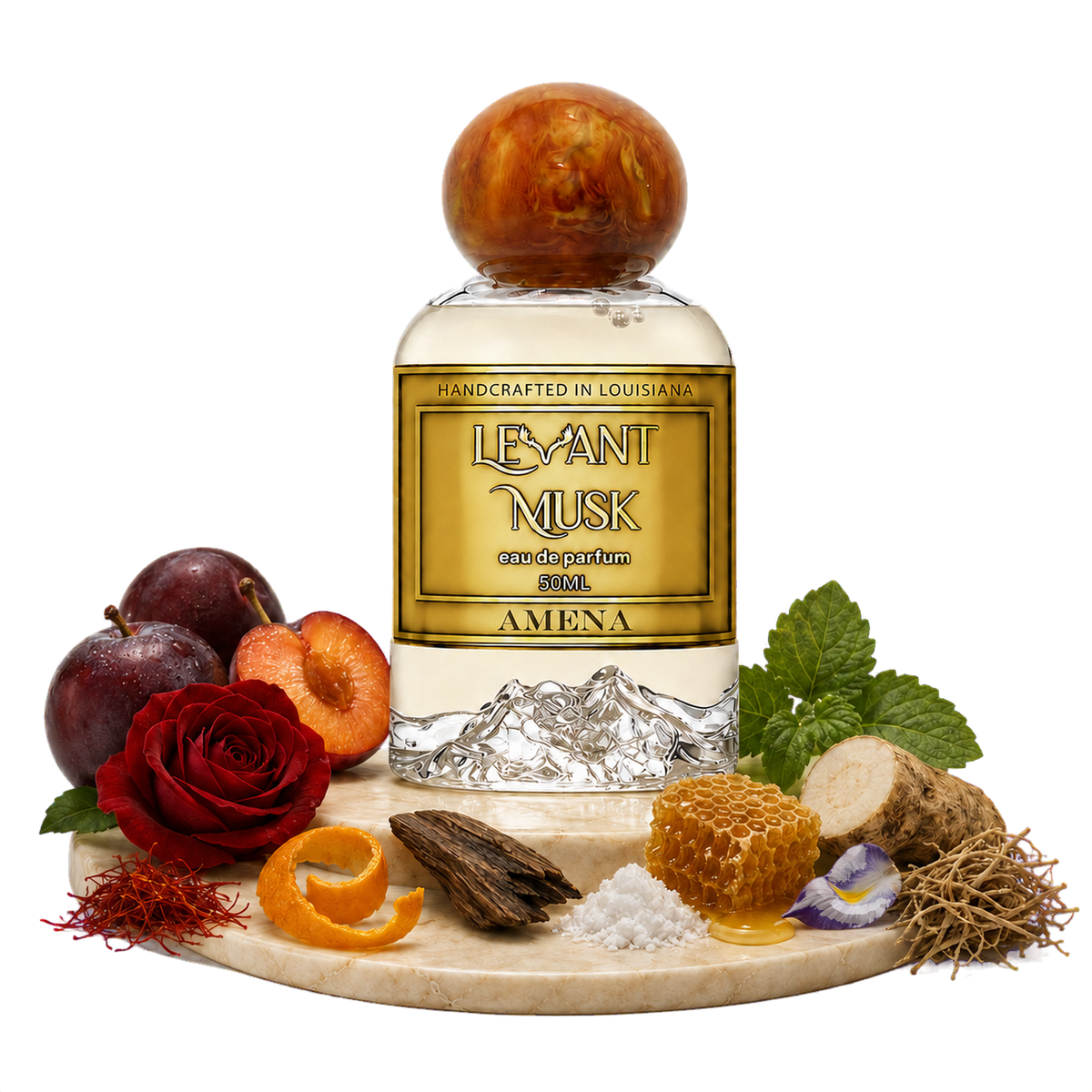 A perfume bottle labeled Amena, by Levant Musk styled on a marble board with botanical and food props including a rose, plums, orange slices, honeycomb, roots, mint, and saffron on a white background.