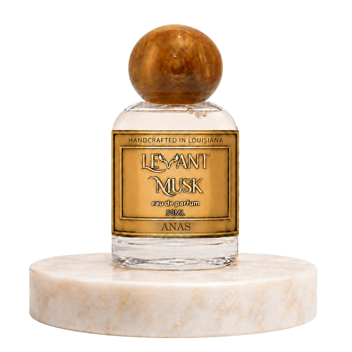 A 50ml bottle of Marwan 'Levant Musk' handcrafted perfume, featuring a clear glass body, amber-colored liquid, a gold label, and a polished amber sphere cap, displayed on a white marble pedestal against a white background.