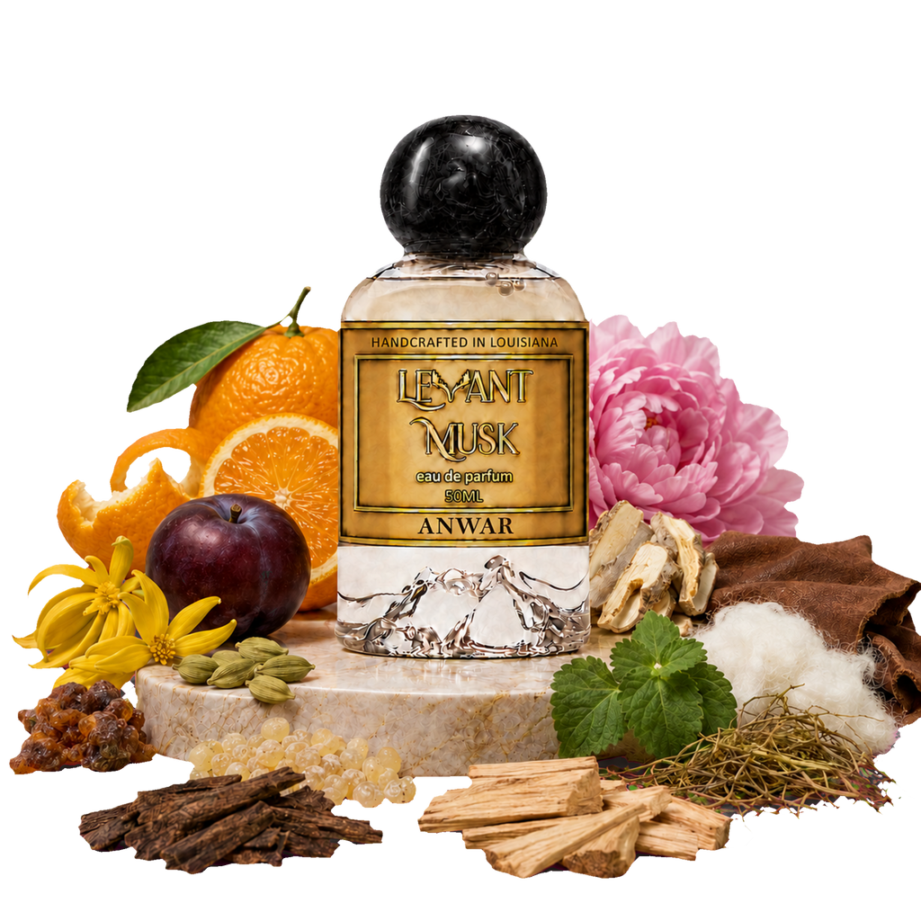A bottle of Anwar by Levant Musk Eau de Parfum centered on a marble pedestal, surrounded by its natural ingredients including oranges, a plum, cardamom, cotton, musk, and flowers.