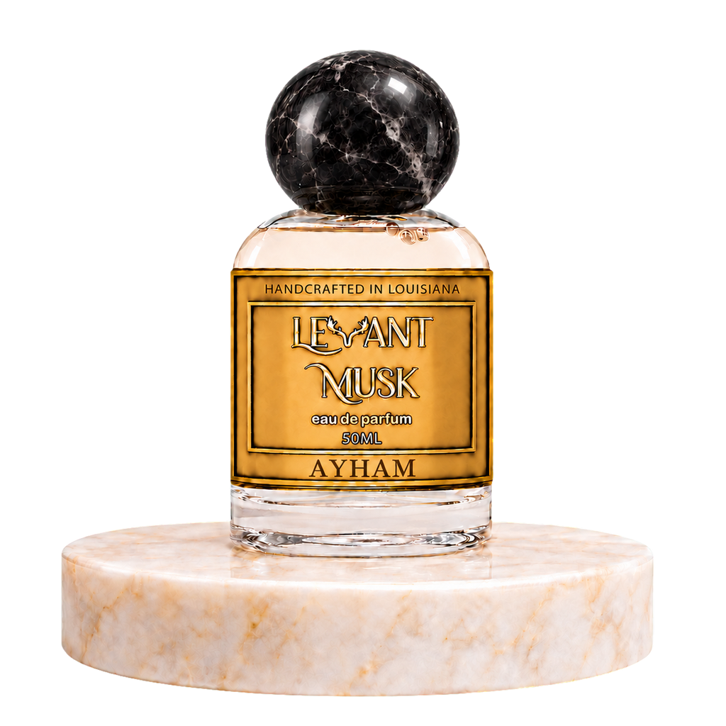 AYHAM 50 mL eau de parfum by Levant Musk with a black marble-patterned round cap, displayed on a marble pedestal.