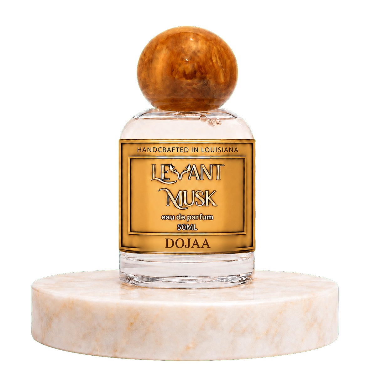 A 50ml bottle of Dojaa 'Levant Musk' eau de parfum , featuring a clear glass bottle with a gold label and a round amber cap, displayed on a white marble pedestal against a white background.