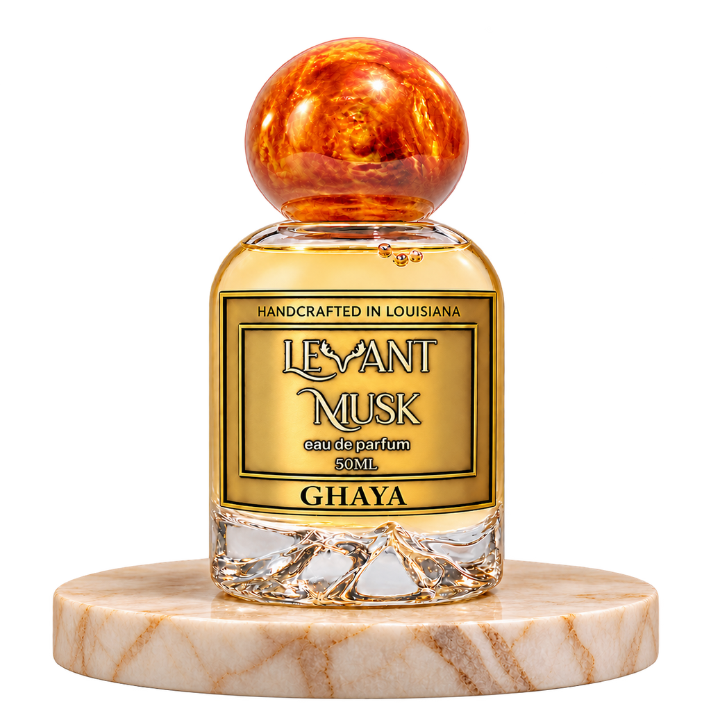 GHAYA 50 mL orange-capped eau de parfum bottle on marble with a transparent background