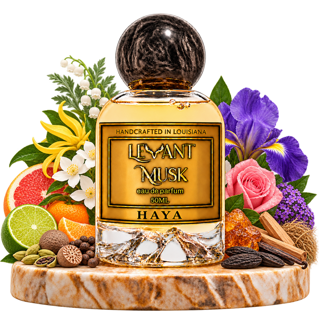 HAYA by Levant Musk on a marble pedestal with citrus, spice, floral and wood note ingredients, with a transparent background.