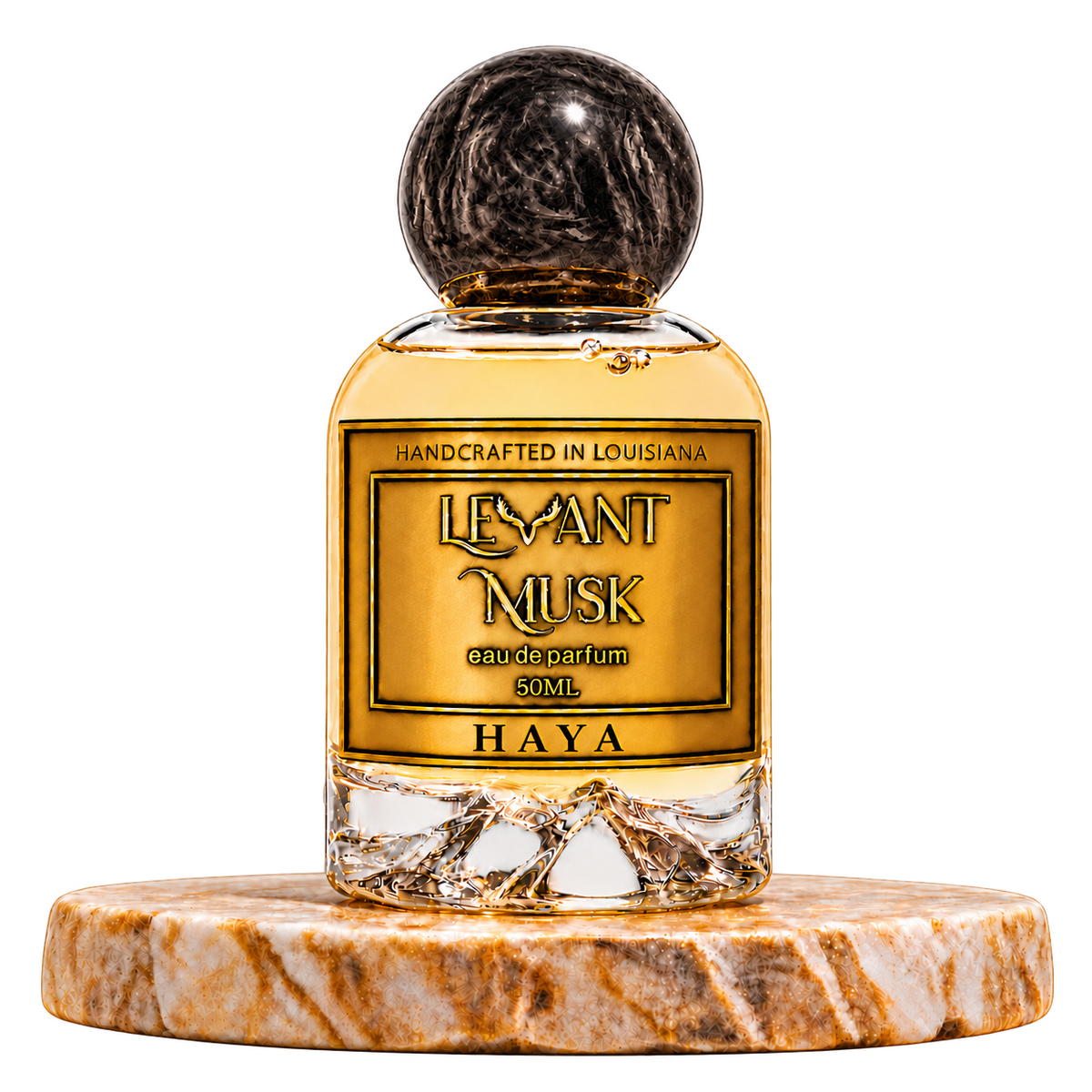 HAYA by Levant Musk, 50 mL eau de parfum with a round black marbled cap and gold label, on a marble pedestal with a transparent background.