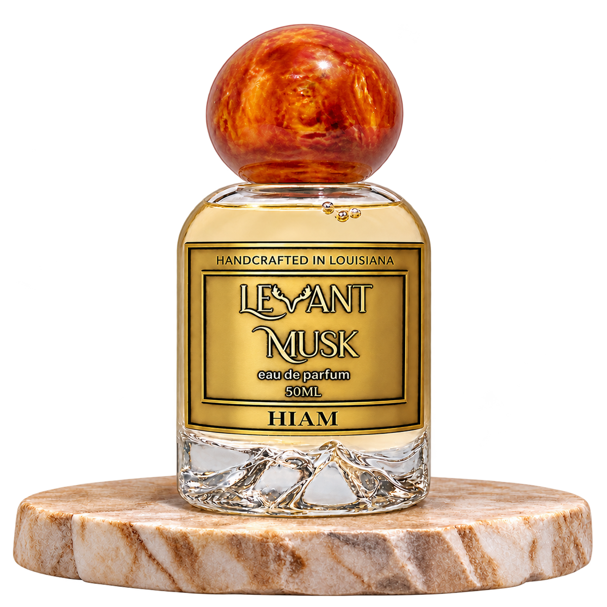 HIAM eau de parfum by Levant Musk, 50 mL unisex bottle with orange-gold cap on travertine, transparent background