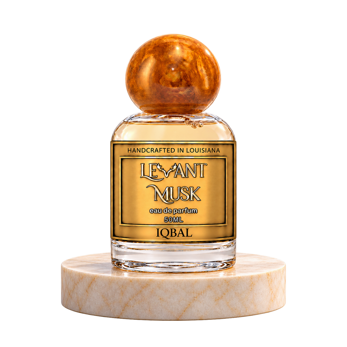 IQBAL 50 mL Levant Musk bottle with orange-gold cap on marble with transparent outer background