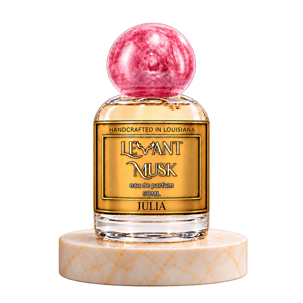 JULIA 50 mL Levant Musk bottle with pink cap on marble with transparent outer background