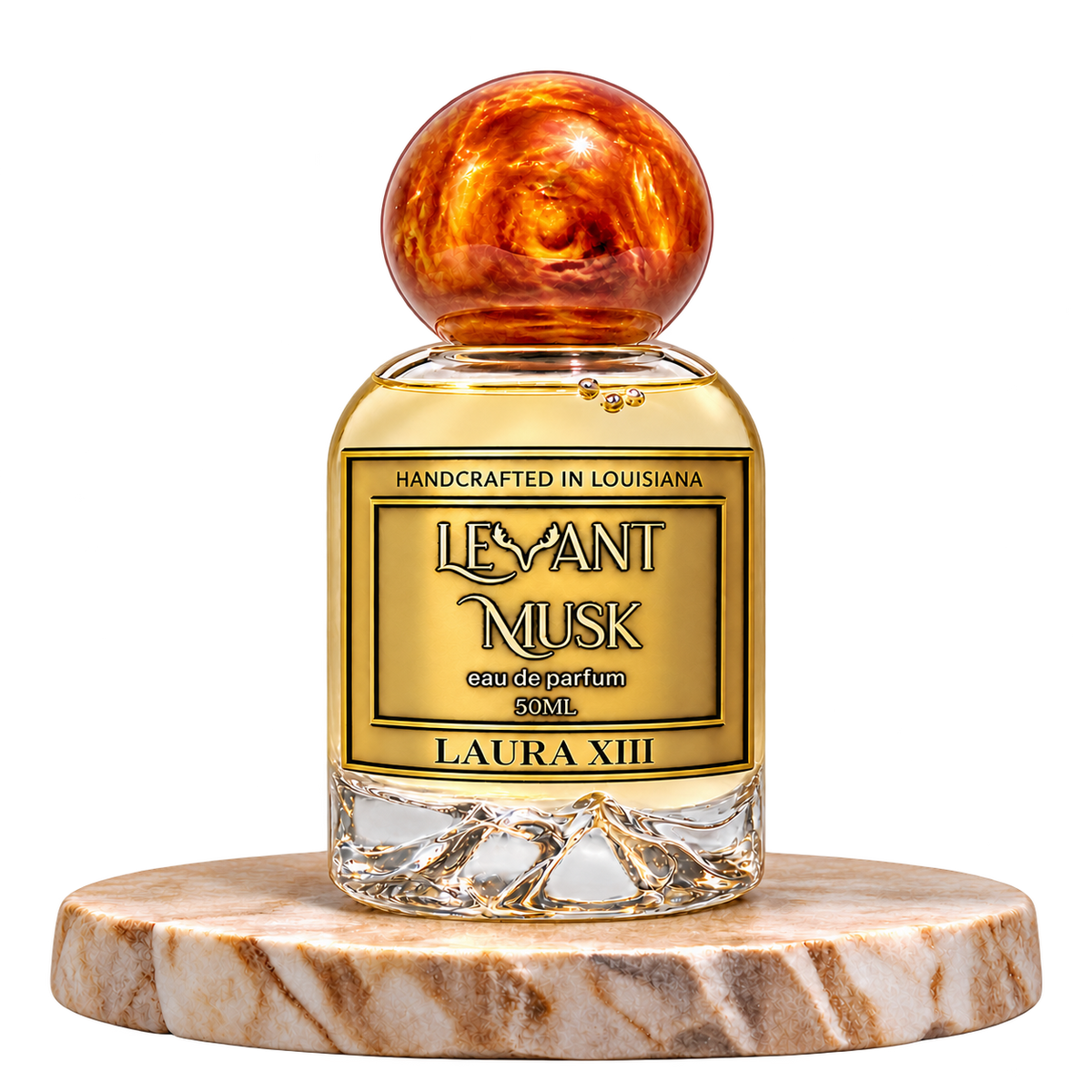 LAURA XIII by Levant Musk, 50 mL eau de parfum with a orange-gold marble cap on a cream marble plinth, transparent background.