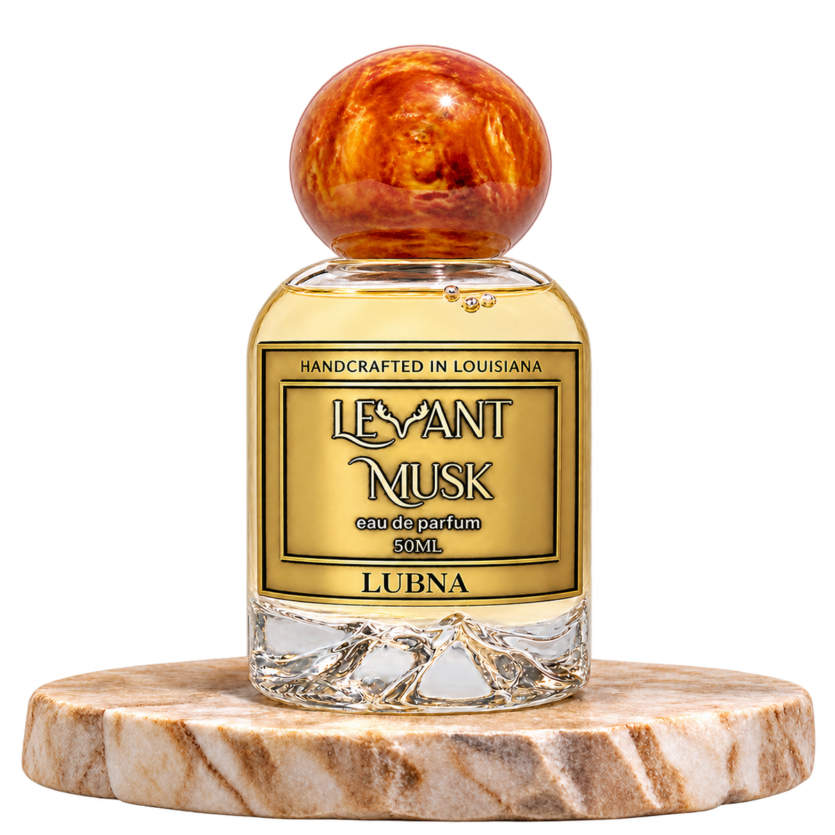 LUBNA by Levant Musk, 50 mL bottle with orange-gold cap on a marble pedestal