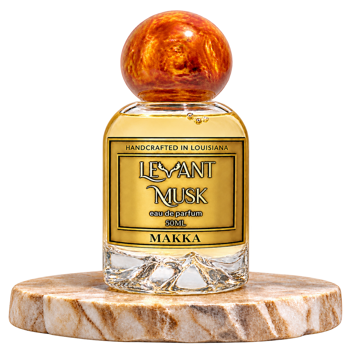 MAKKA by Levant Musk, 50 mL bottle with orange-gold cap on a marble pedestal