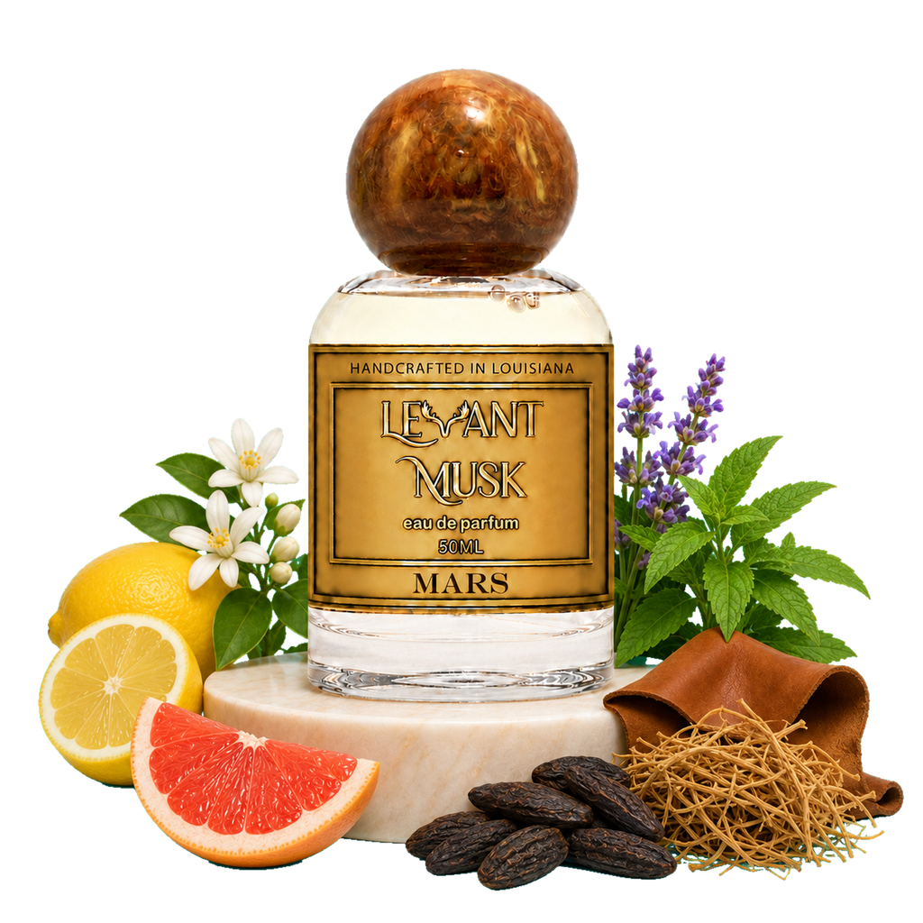 A bottle of MARS by Levant Musk Eau de Parfum 50ml, styled with its scent ingredients including lemons, grapefruit, green leaves, purple flowers, and spices on a white background.