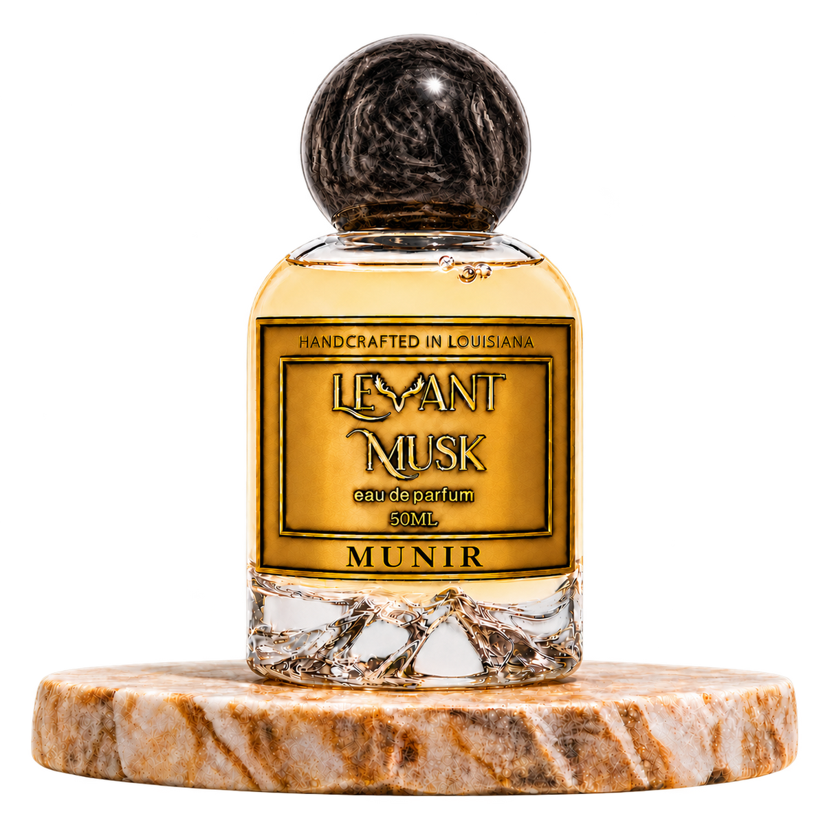 MUNIR by Levant Musk, 50 mL eau de parfum with black marbled cap on a marble pedestal, transparent background