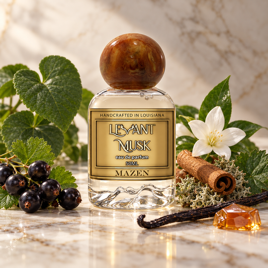 A bottle of Mazen LeYant Musk eau de parfum, 500ml, styled on a marble surface with its scent notes including blackcurrants, white flower, cinnamon, vanilla, and amber honey.