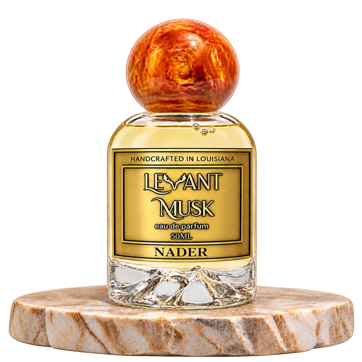 NADER by Levant Musk, 50 mL bottle with orange-gold cap on a marble pedestal
