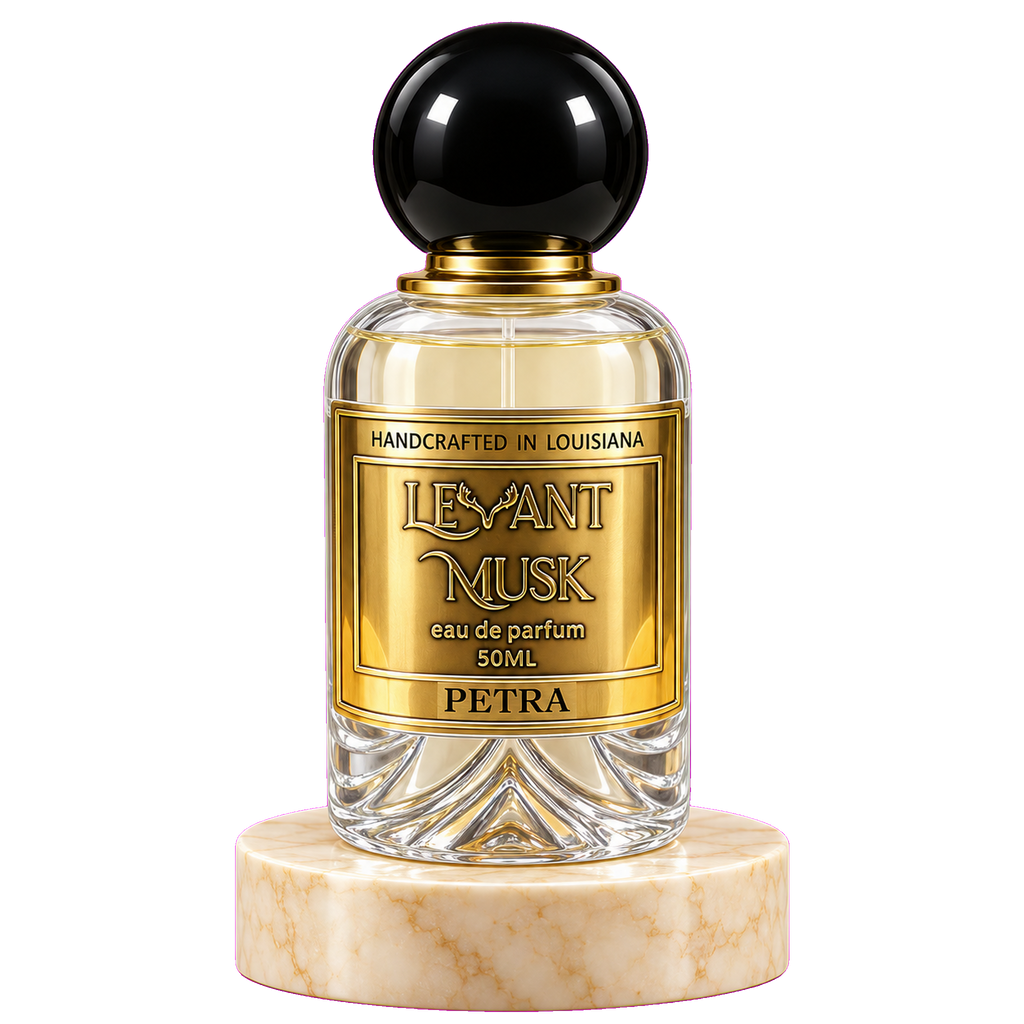 A 50ml bottle of Petra Levant Musk Eau de Parfum, featuring a clear glass body with a gold label, a black spherical cap, and a cream-colored marble base, set against a plain white background.