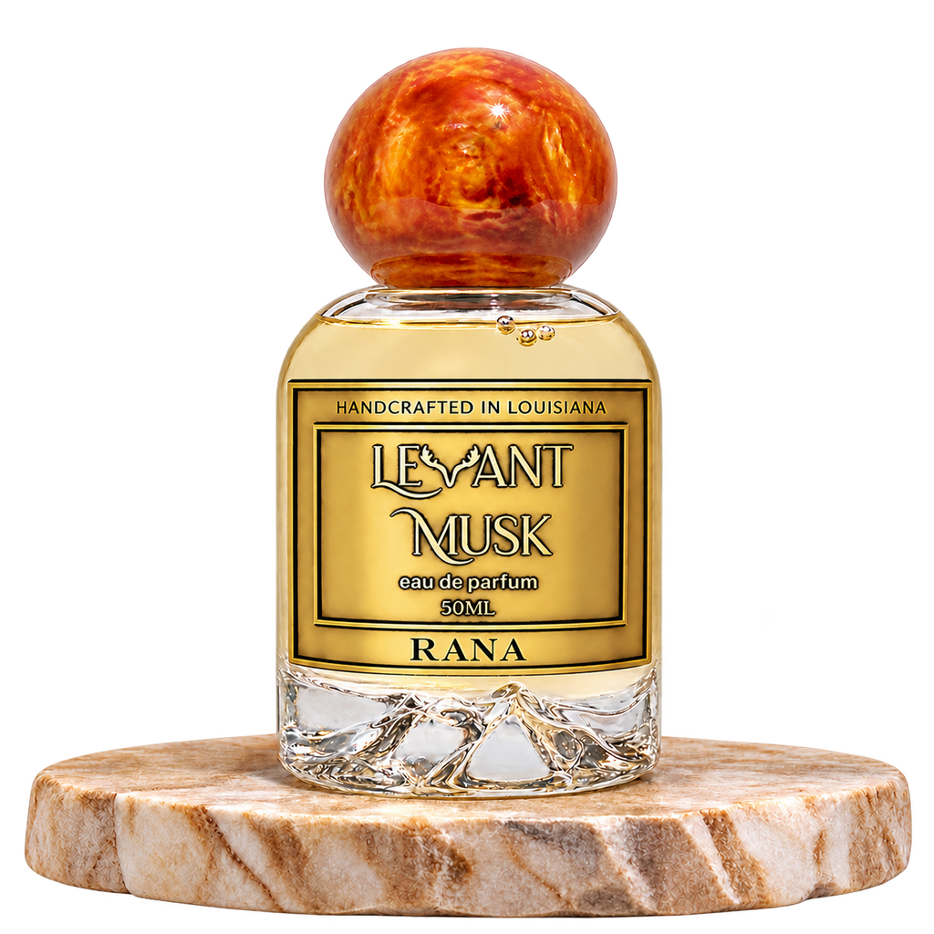 RANA by Levant Musk bottle alone on a beige marble platform with transparent background