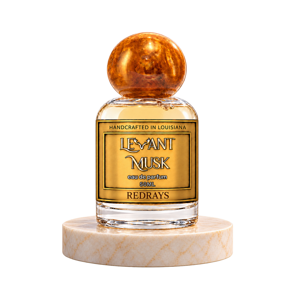 REDRAYS 50 mL Levant Musk bottle with orange-gold cap on marble with transparent outer background