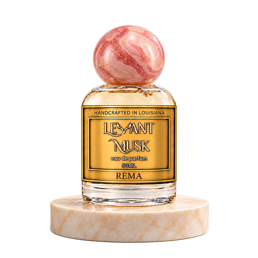 REMA 50 mL Levant Musk bottle with pink cap on marble with transparent outer background