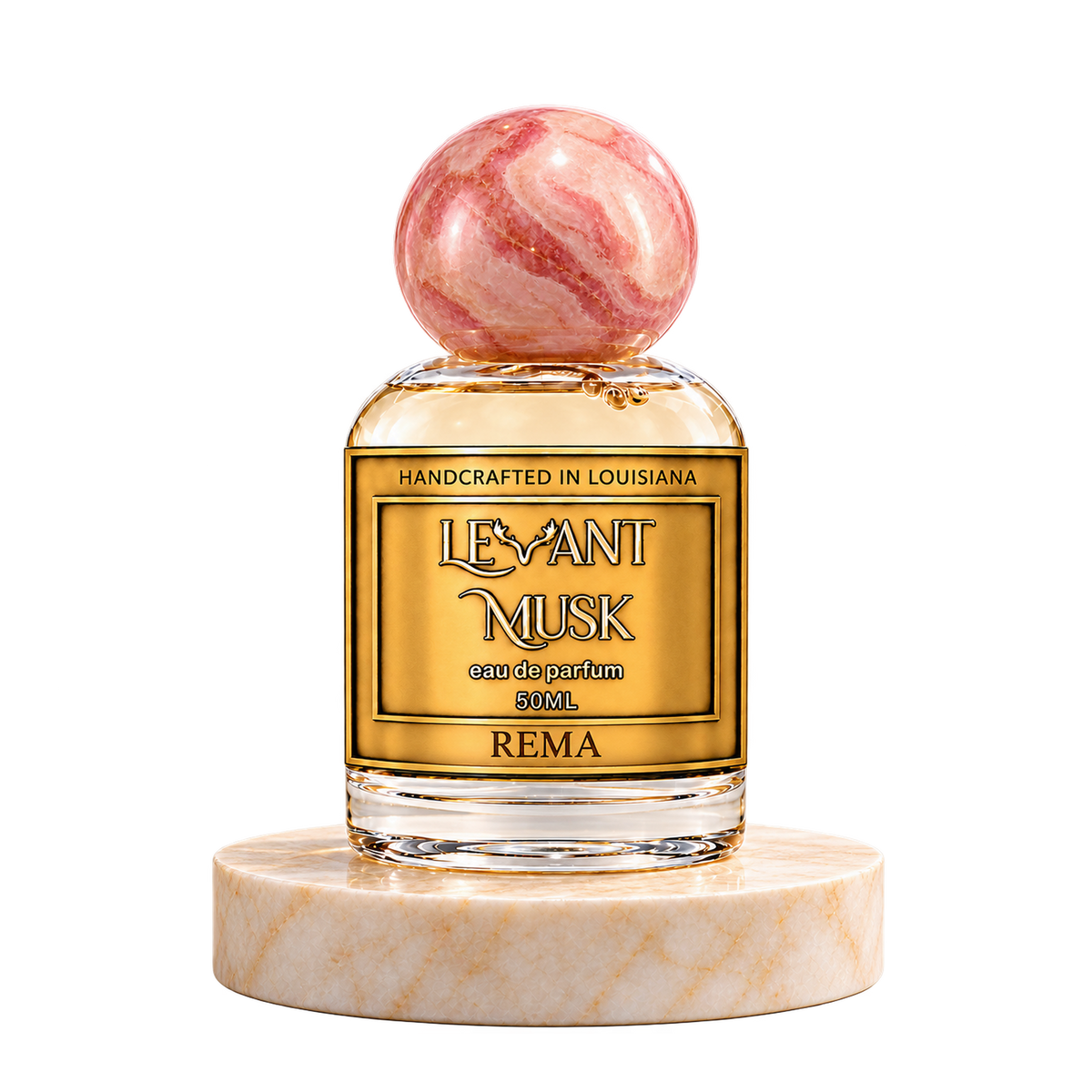 REMA 50 mL Levant Musk bottle with pink cap on marble with transparent outer background