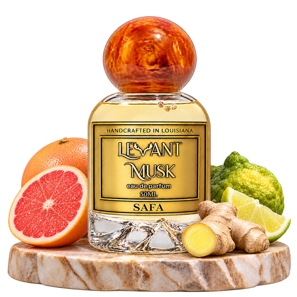 SAFA perfume with its main notes of grapefruit, bergamot and fresh ginger on a cream pedestal, transparent background