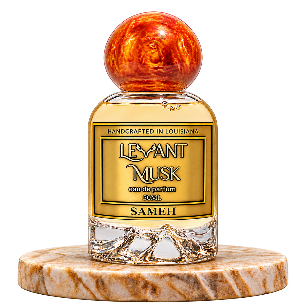 SAMEH by Levant Musk, 50 mL eau de parfum with orange-gold marbled spherical cap, standing alone on a marble pedestal with transparent background