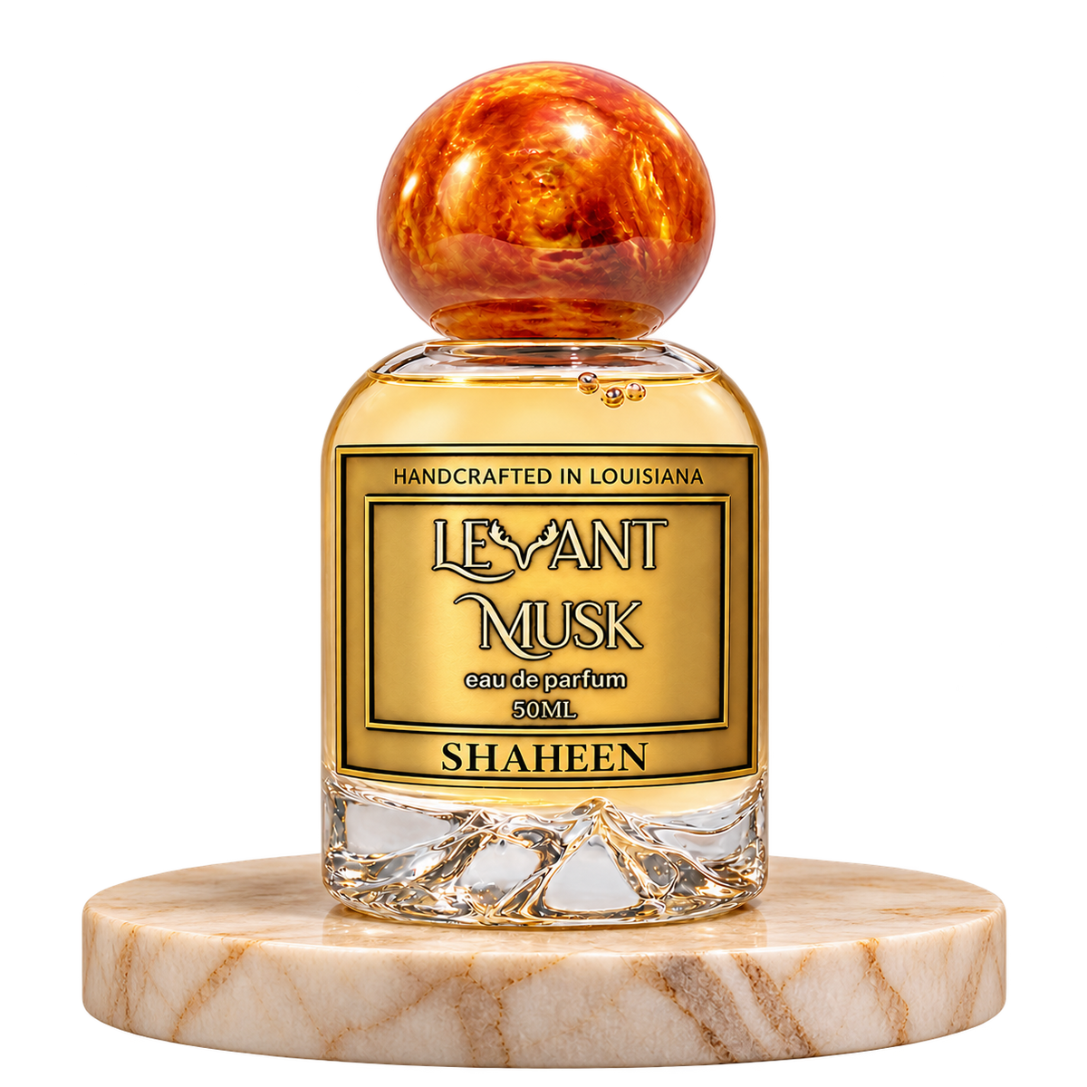SHAHEEN 50 mL Levant Musk bottle with orange-gold cap on marble and transparent outer background