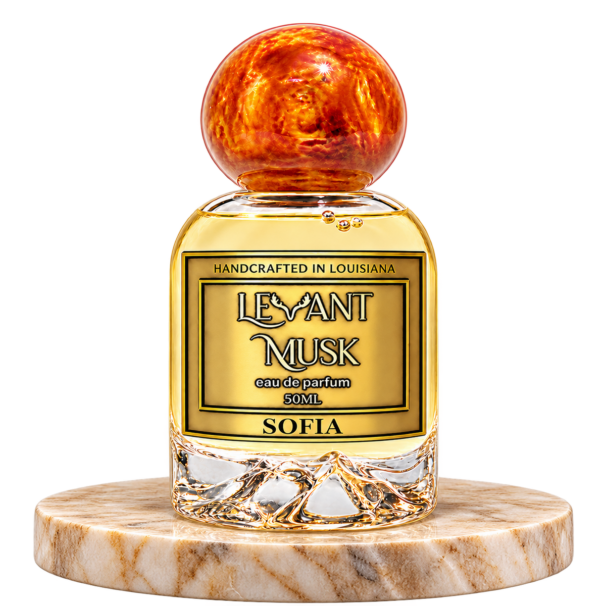 SOFIA by Levant Musk, 50 mL unisex eau de parfum in a rounded clear bottle with orange-gold cap, standing alone on a cream marble base with transparent background.