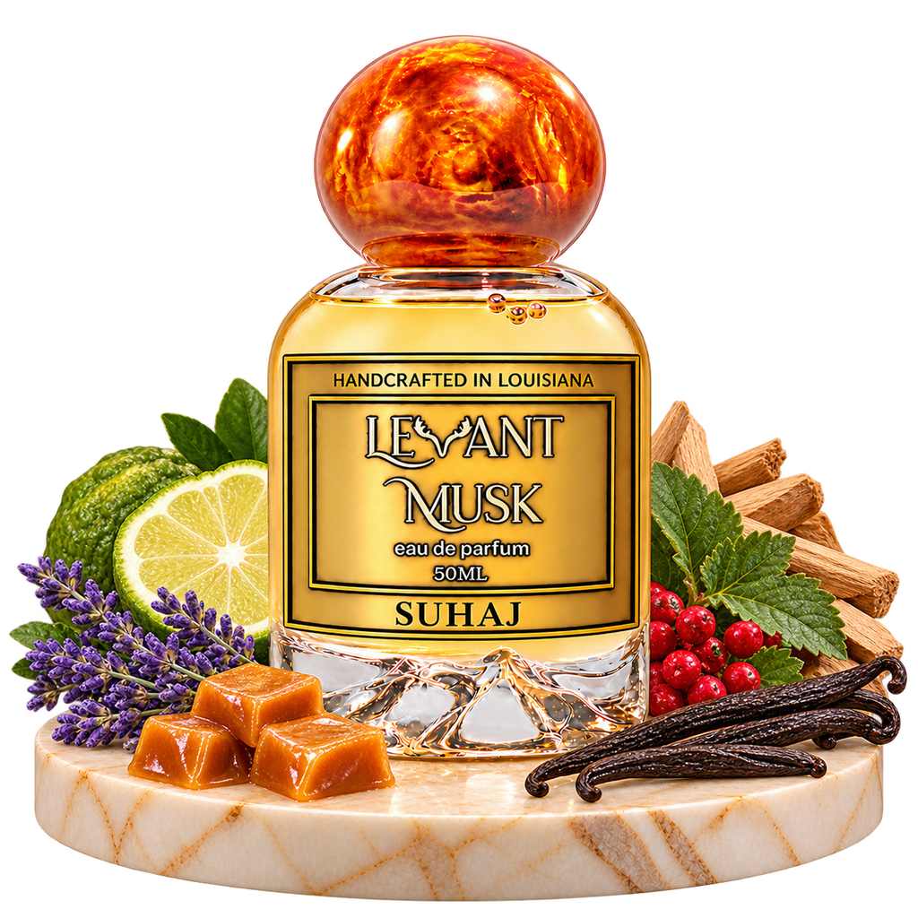 SUHAJ orange-cap perfume bottle with bergamot, lavender, vanilla, caramel, red berries, sandalwood and patchouli props