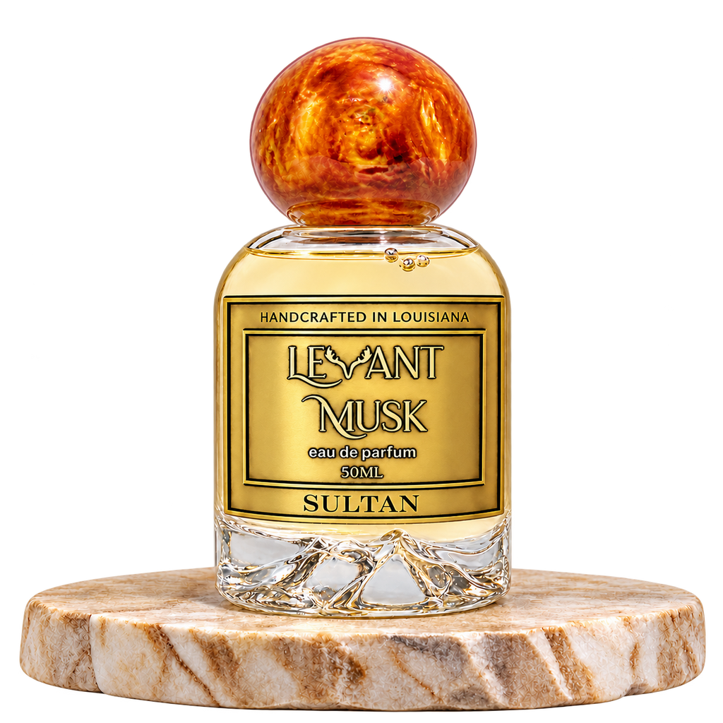 SULTAN by Levant Musk, 50 mL bottle with orange-gold cap on a marble pedestal