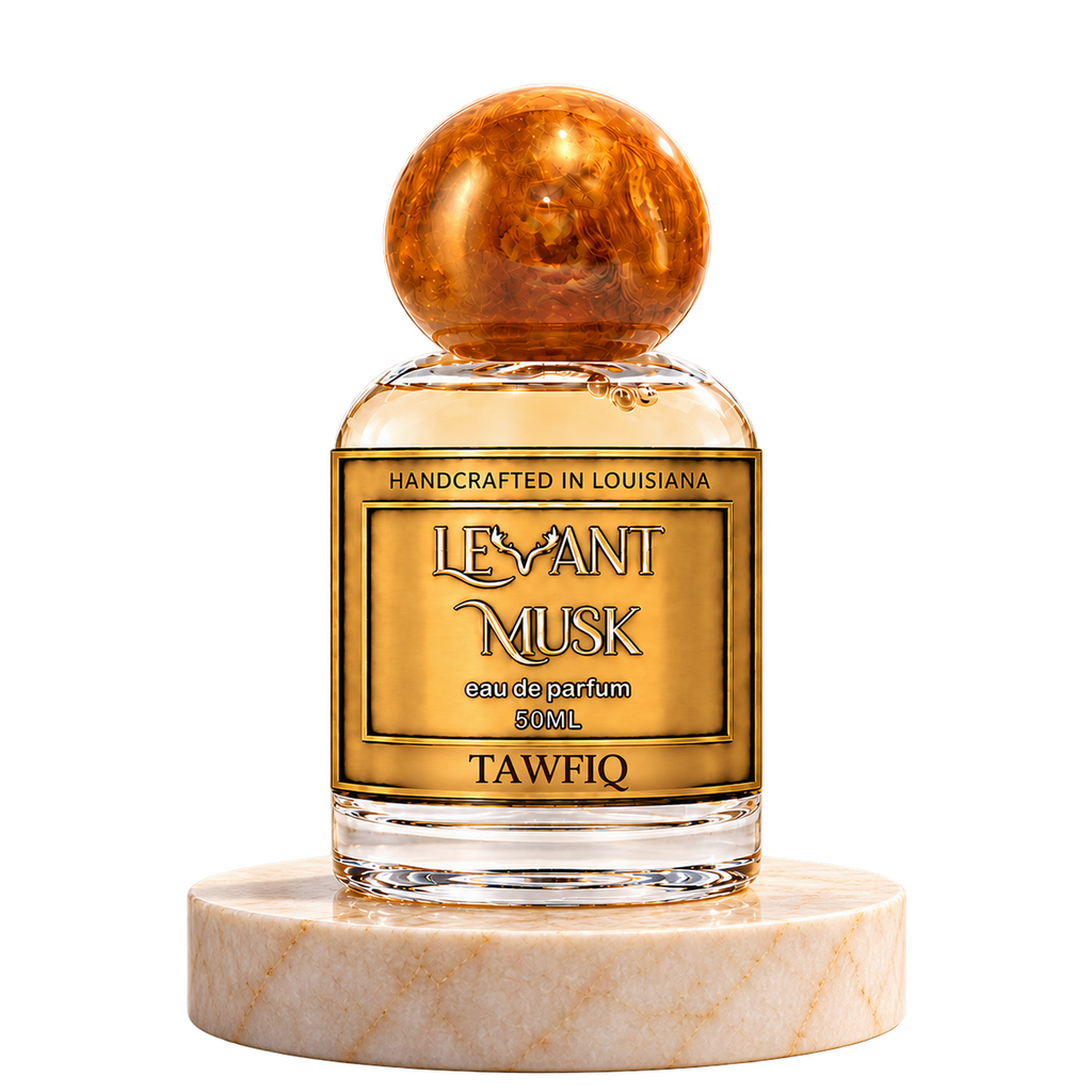 TAWFIQ 50 mL Levant Musk bottle with orange-gold cap on marble with transparent outer background