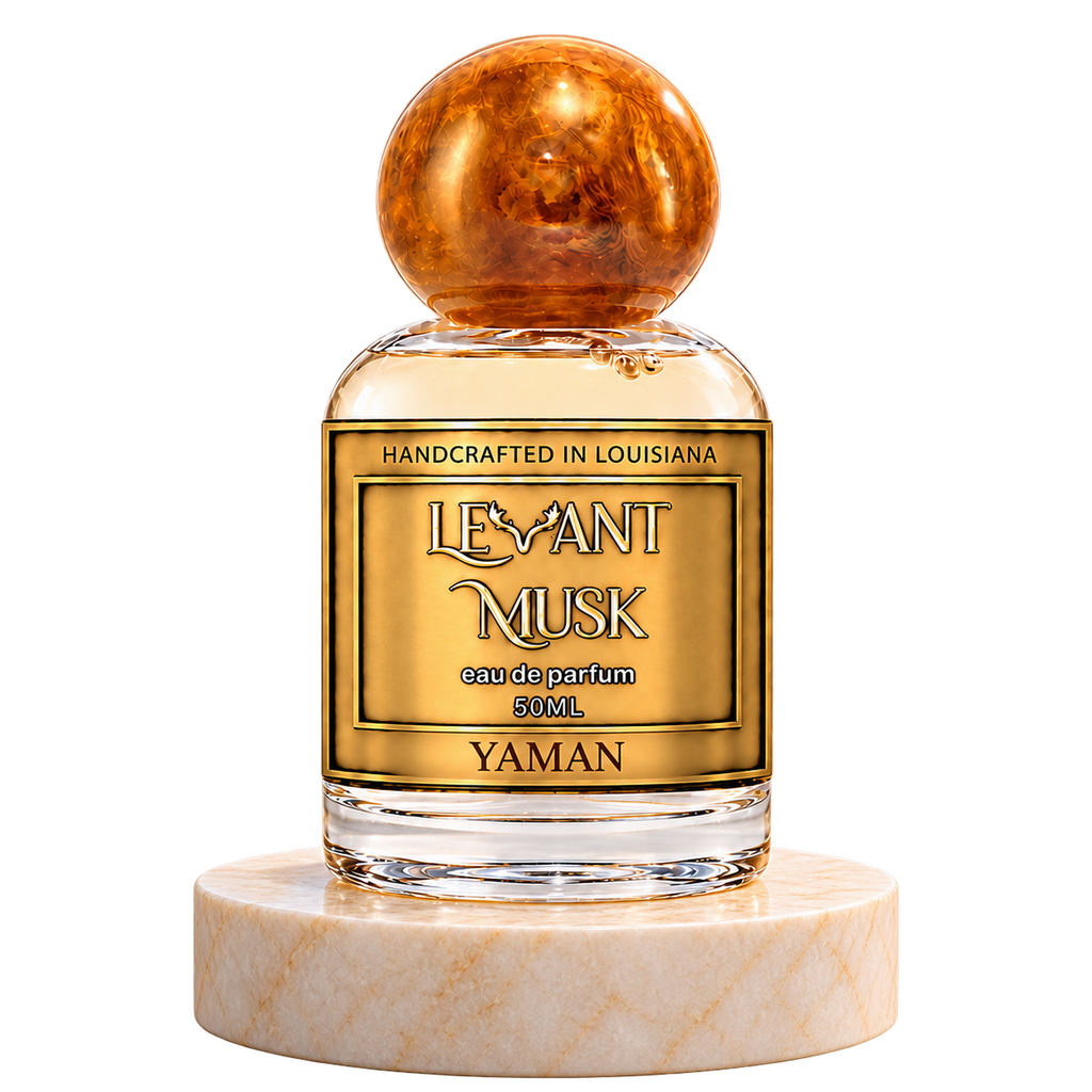 YAMAN by Levant Musk, 50 mL eau de parfum with an orange marble lid on a cream marble pedestal.