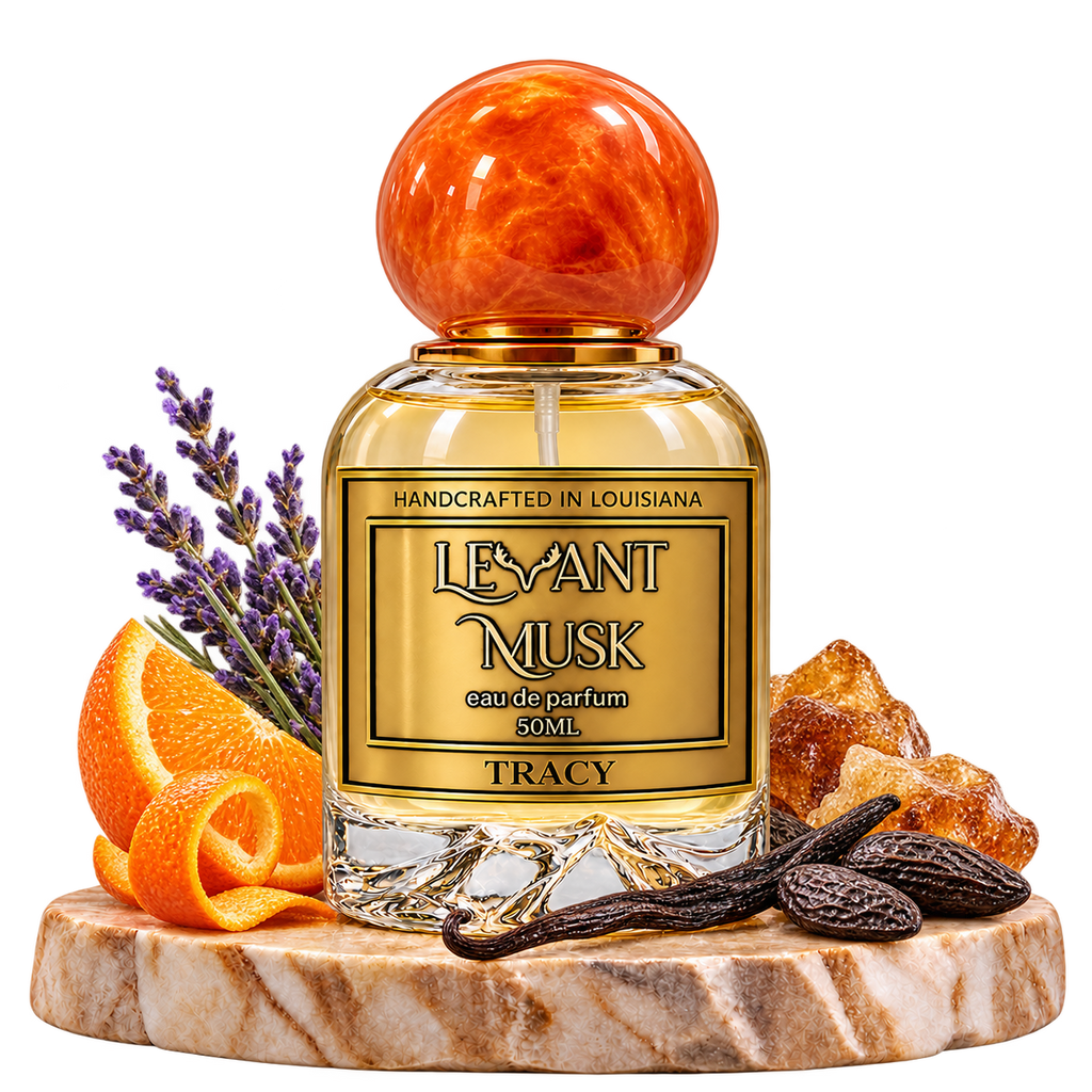 TRACY by Levant Musk, bottle with fragrance-note props on a marble pedestal